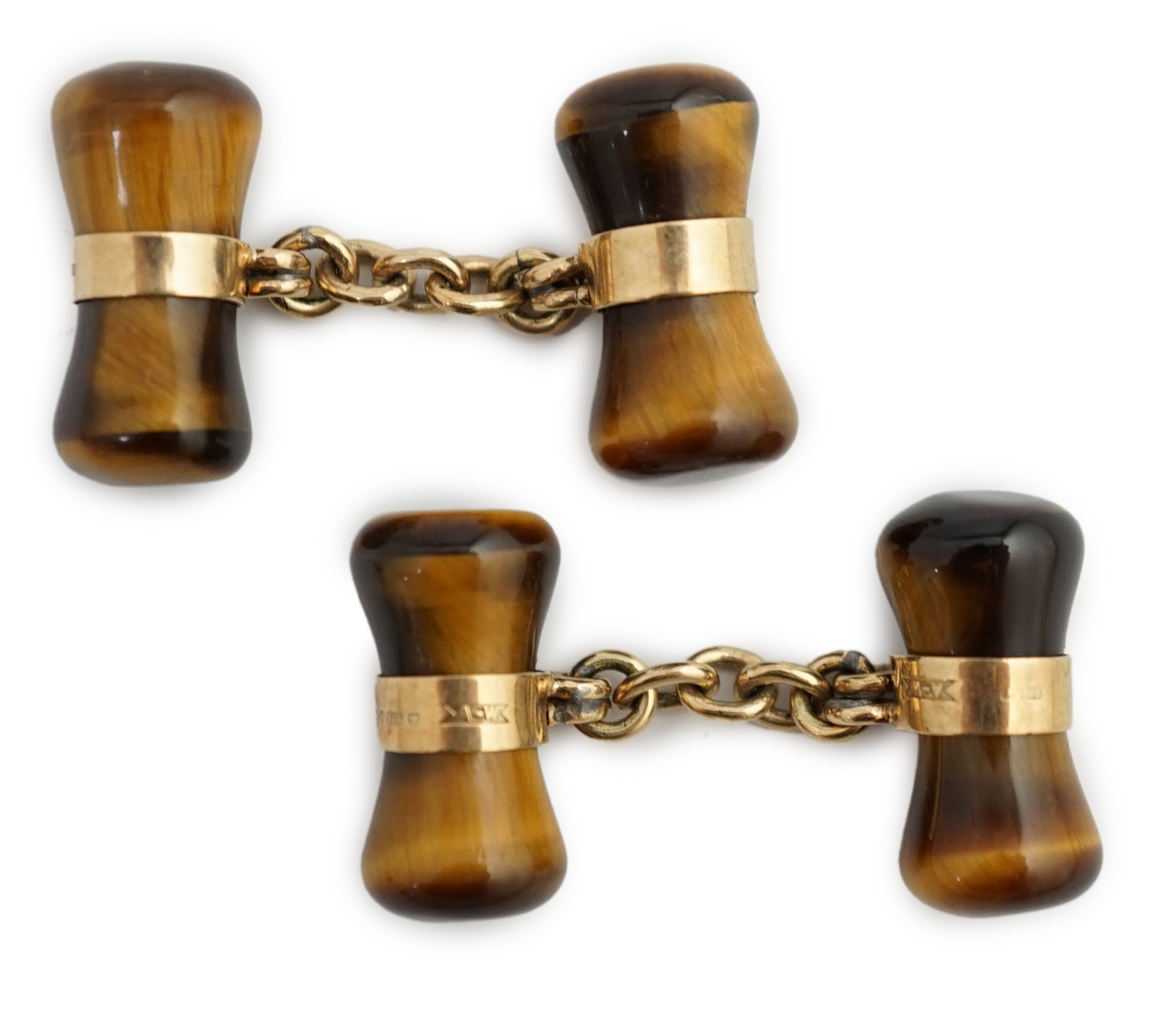 A pair 1970's 9ct gold and tigers eye quartz set dumbbell cufflinks